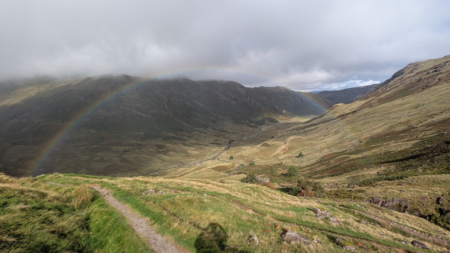 A rainbow across the valley from Stake Pass on the Cumbria Way